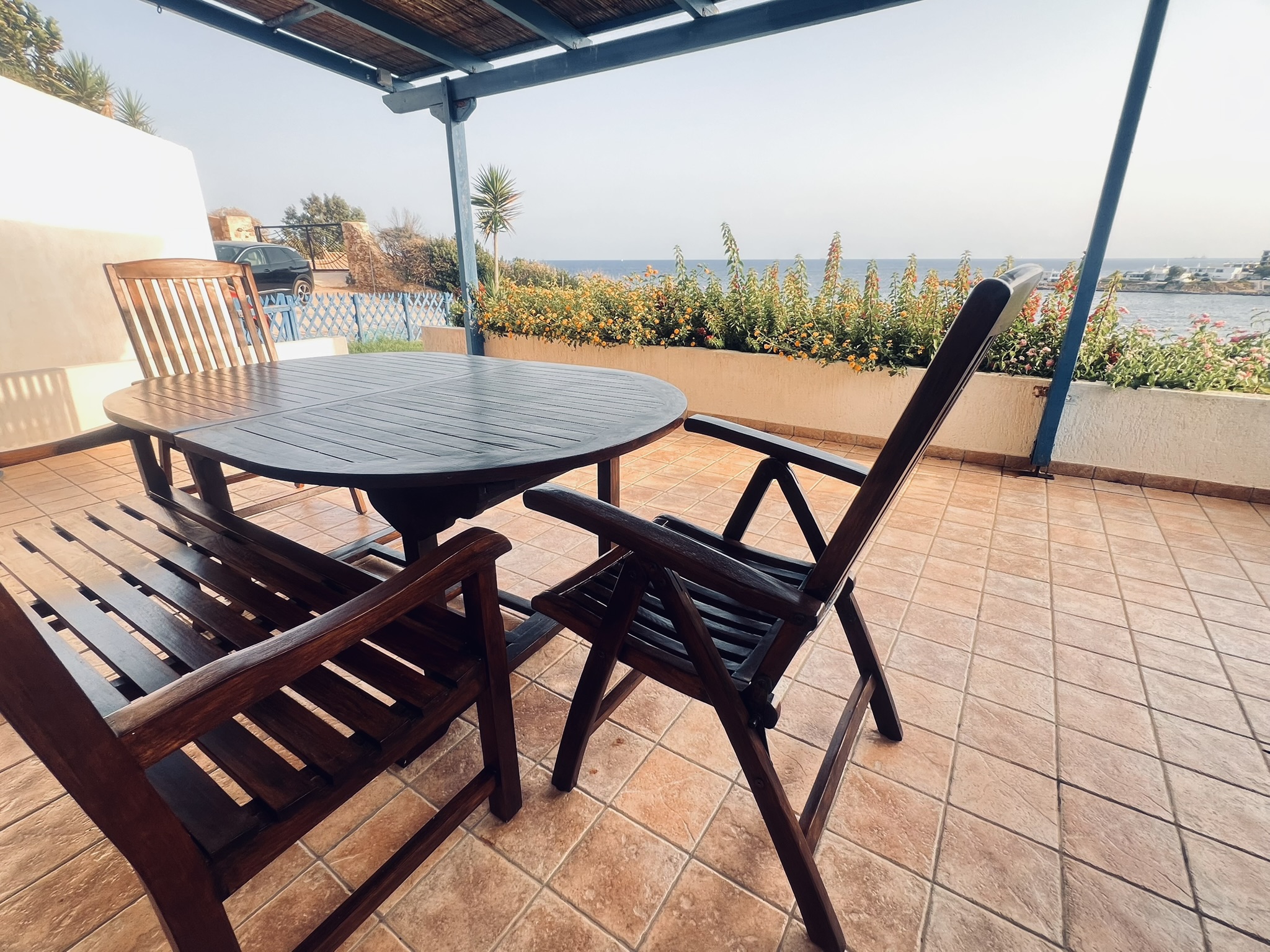 Outdoor dining table on the terrace with sea view